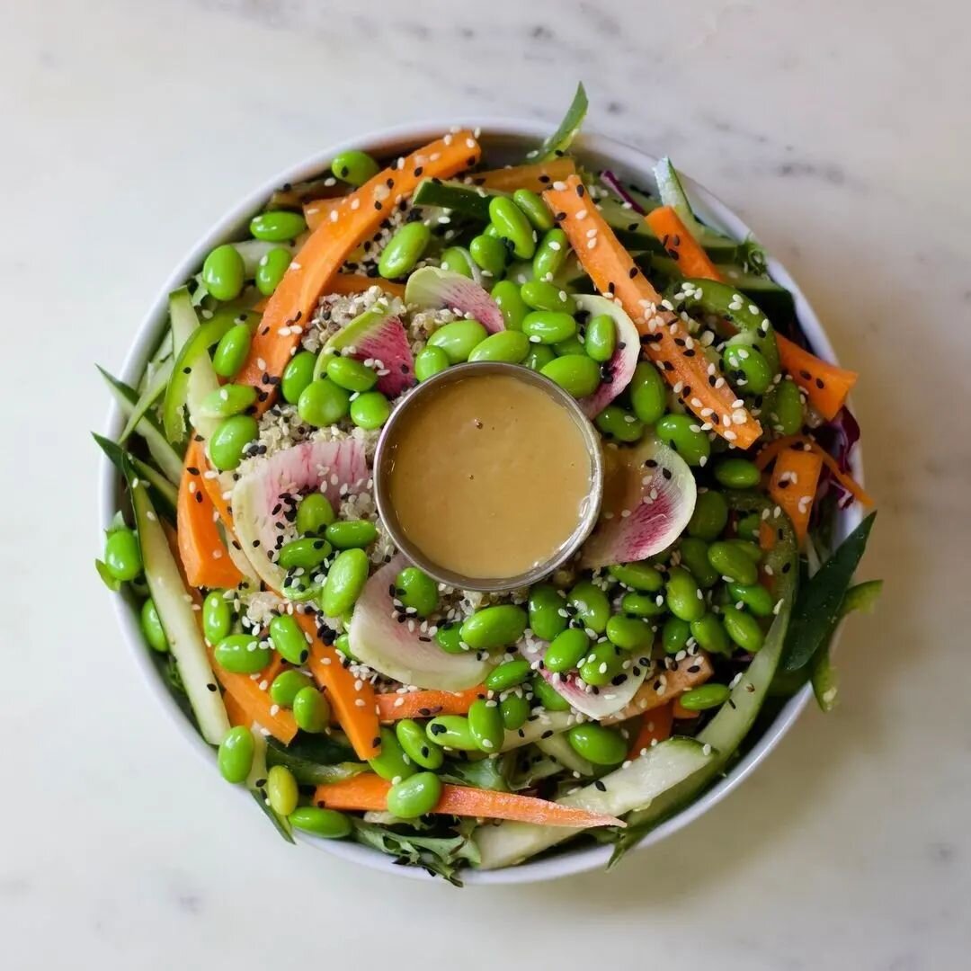 Have you enjoyed our Bowl of Plenty yet?⁠
⁠
It's a hearty bowl of mixed greens, quinoa, edamame, carrot, cucumber + jalape&ntilde;o mixed veg, miso ginger dressing, and sesame seeds. Make it even heartier with a side of our chilled marinated tofu.⁠
⁠
